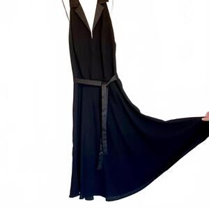 Black backless, midi dress with halter neckline, fit and flare dress